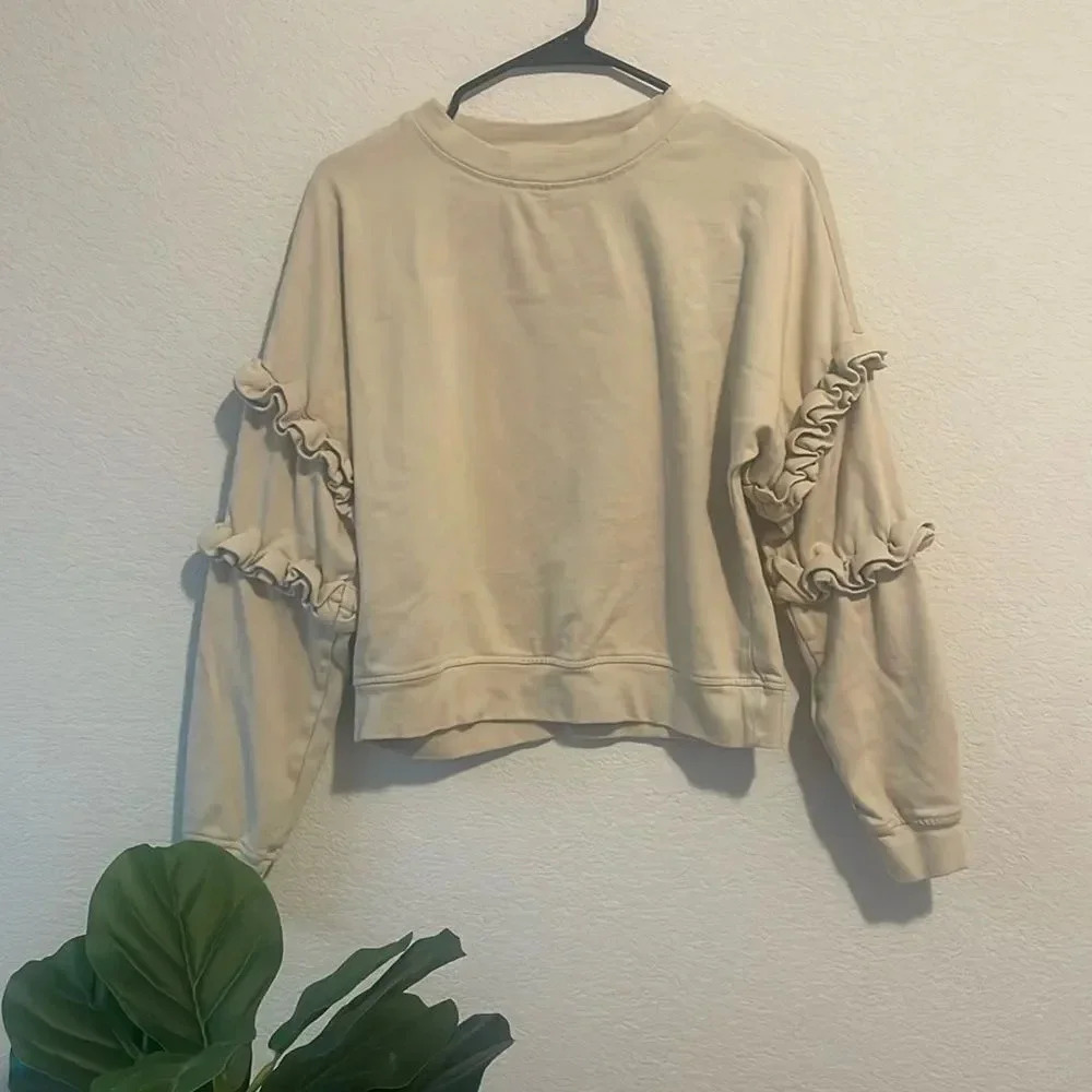For The Republic Cream Ruffle Sleeve Sweatshirt